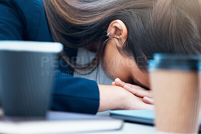 Buy stock photo Closeup shot of a young businesswoman sleeping at her desk in an office