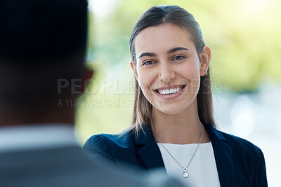 Buy stock photo Shot of a young businesswoman having a discussion with a colleague in an office