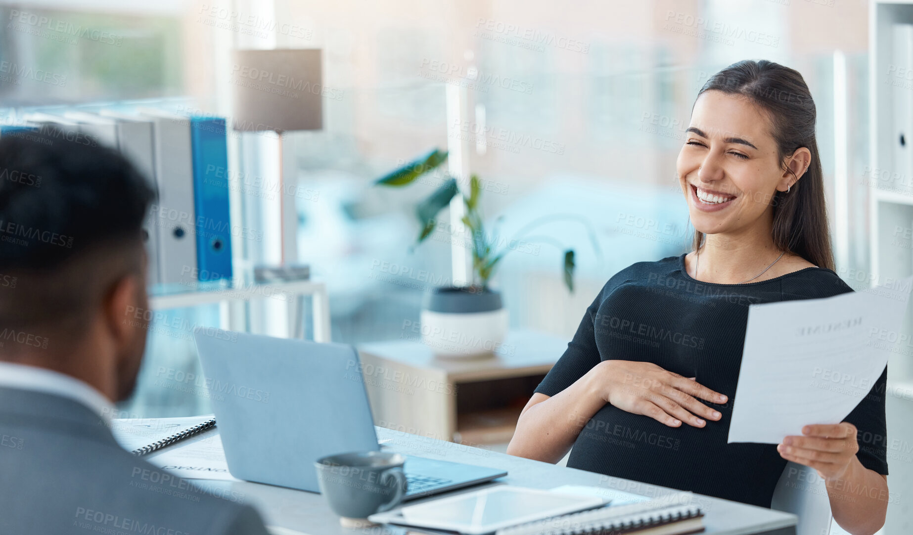 Buy stock photo Shot of a young businesswoman going through a resume from an applicant during a job interview in an office