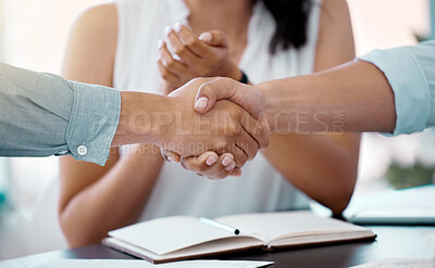Buy stock photo Closeup shot of businesspeople shaking hands during a meeting in an office