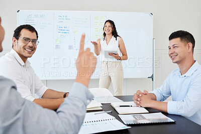 Buy stock photo Shot of a young businesswoman leading a meeting with her colleagues in an office