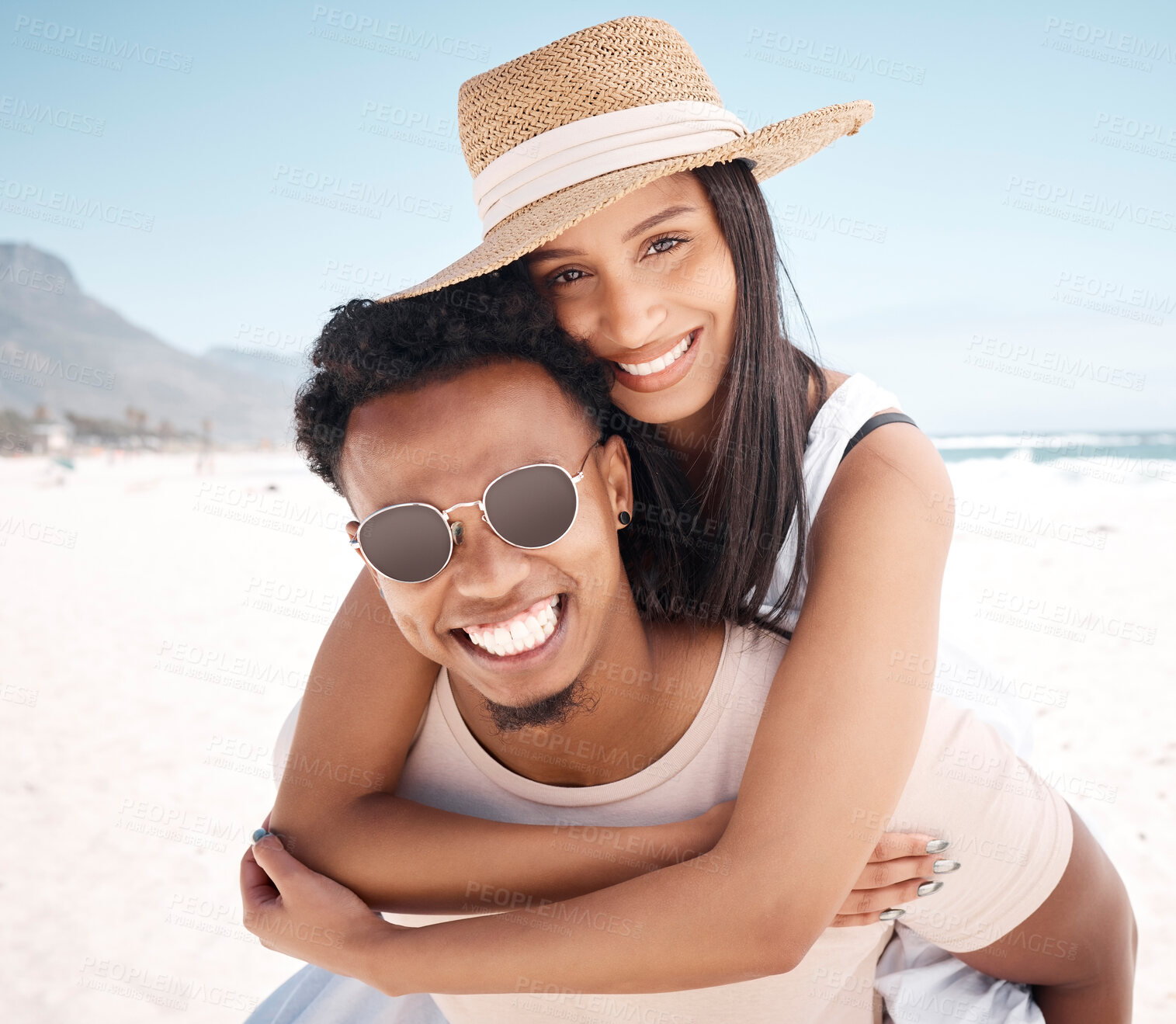 Buy stock photo Couple, portrait and piggyback on beach trip, outdoor games and happy for ocean adventure. People, tropical romance and love for marriage on vacation at sea, carrying wife and sand date on holiday