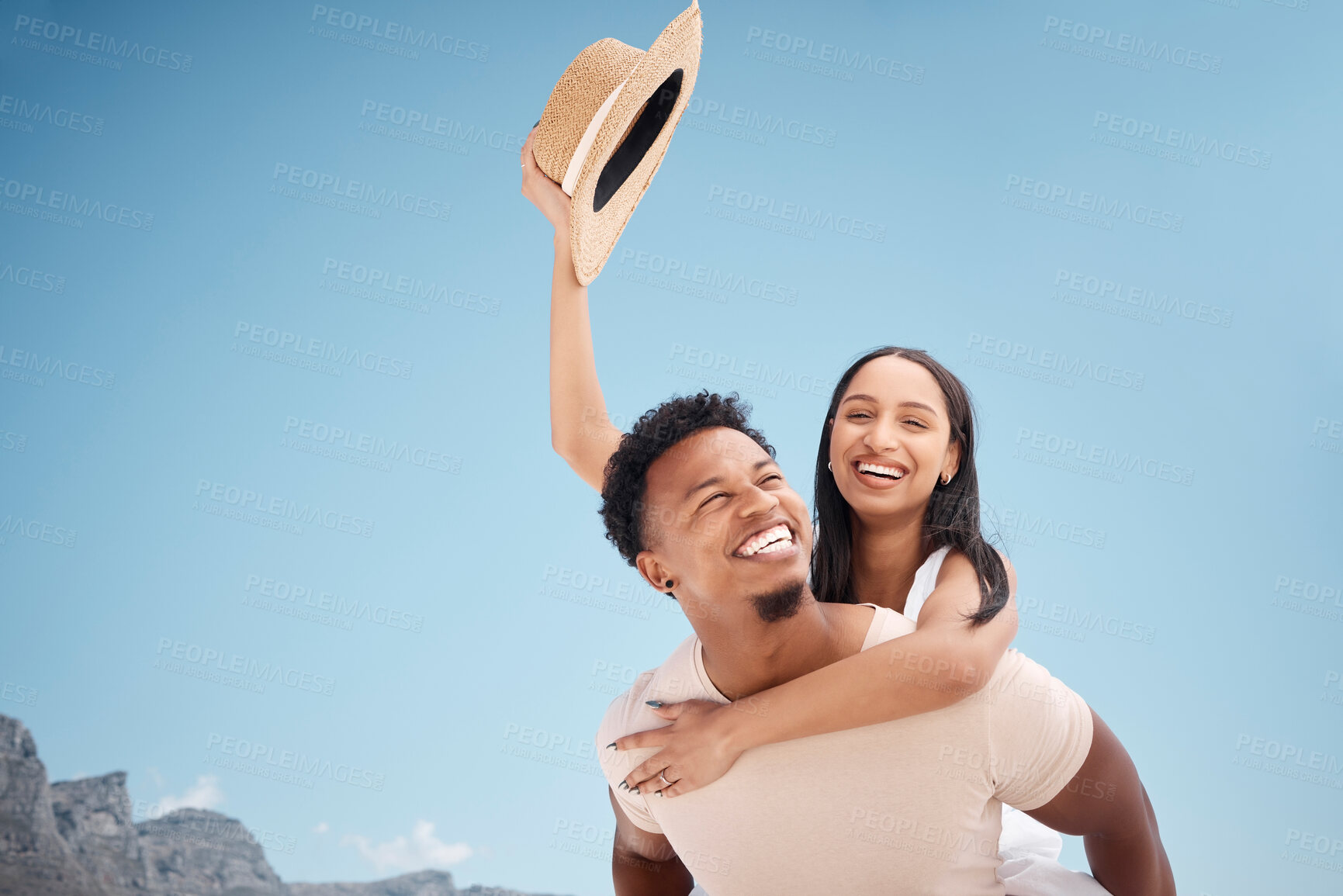 Buy stock photo Couple, travel and piggyback laughter in outdoor, funny games and happy for blue sky adventure. People, romance fun and love for marriage on vacation in nature, carrying wife and date on holiday