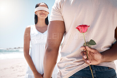 Buy stock photo Shot of a young couple having a romantic date at the beach