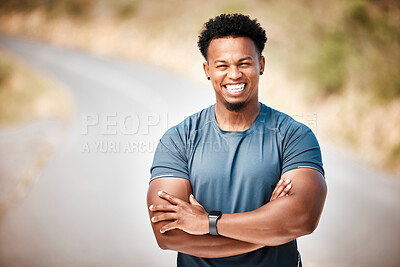 Buy stock photo Shot of a man standing with crossed arms outside