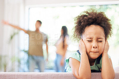 Buy stock photo Shot of a little girl covering her ears while her parents argue in the background