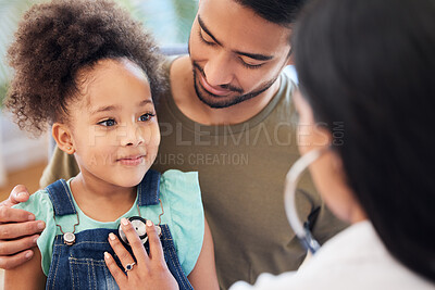 Buy stock photo Shot of a little girl sitting on her father's lap while being examined by her doctor