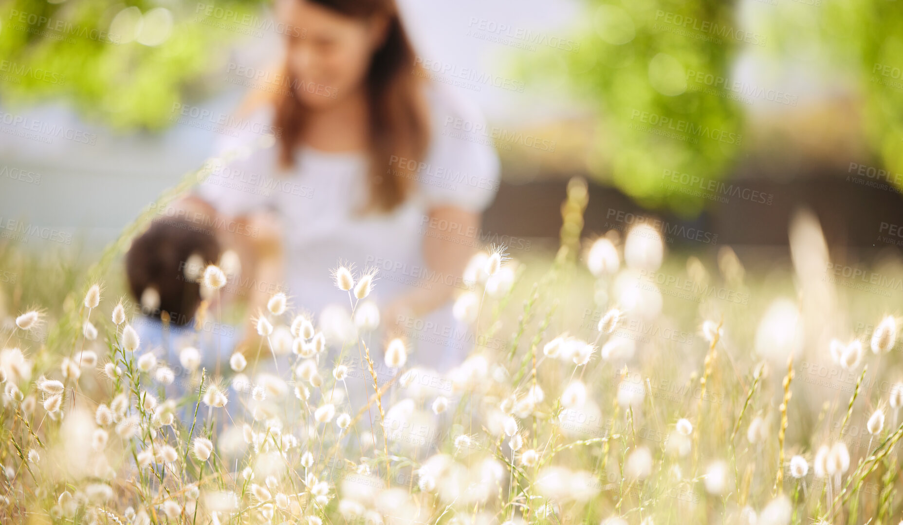 Buy stock photo Mother, child and nature with flowers, tress and field for bonding, love and holiday time together outdoor. Woman, kid and playing at park as family in summer for happiness, weekend and vacation