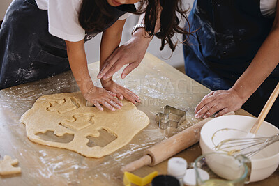 Buy stock photo Shot of a little girl pressing out cookies with a cookie cutting