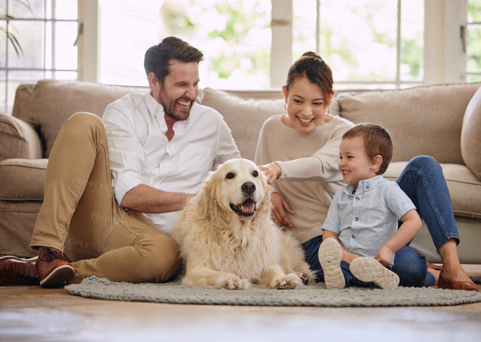 Buy stock photo Family, home and dog with child, mom and dad in living room with love and laughing. Animal, pet and mother with father and young kid with happiness in a house with golden retriever and care on floor