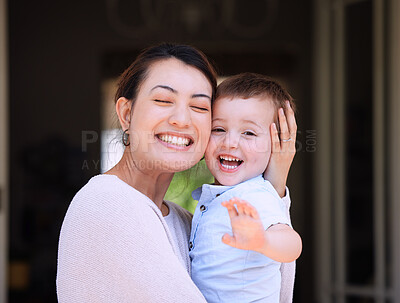 Buy stock photo Shot of a mother carrying her son on the porch at home