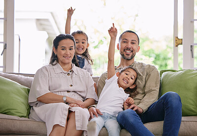 Buy stock photo Man, woman and portrait of family on sofa for weekend fun, support and bonding together at home. Happy, daughter and kids with point in living room for playful, childhood care and love on fathers day