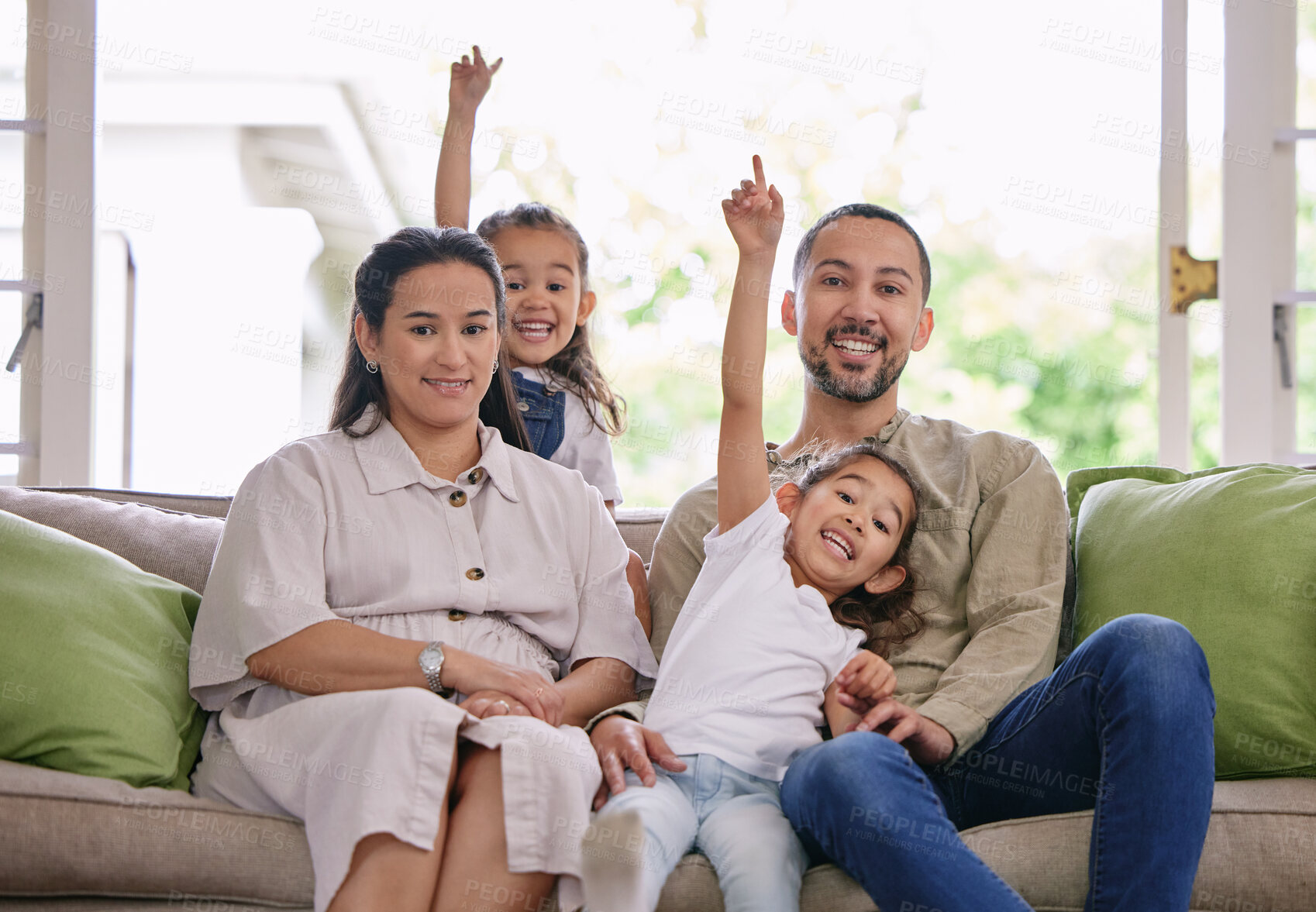 Buy stock photo Man, woman and portrait of family on sofa for weekend fun, support and bonding together at home. Happy, daughter and kids with point in living room for playful, childhood care and love on fathers day