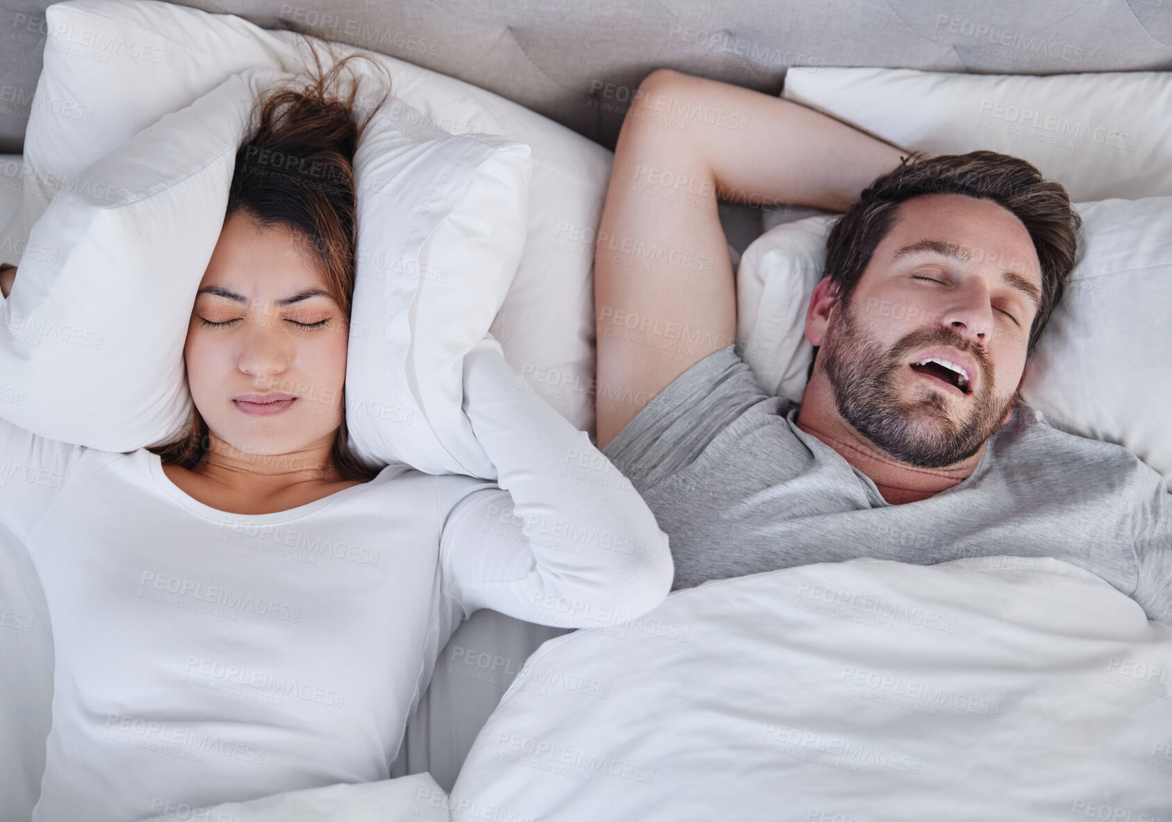 Buy stock photo Snoring, stress and above angry woman with sleeping man in bed, unhappy and frustrated, insomnia and crisis. Bedroom, fail and top view of lady with noise, issue and annoyed by snore or sleep apnea 