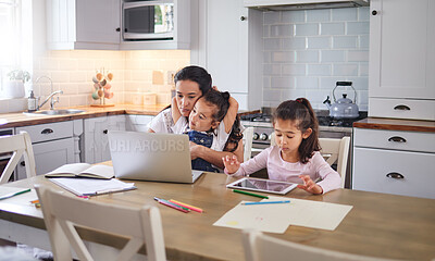 Buy stock photo Shot of a mother helping her daughter with her homework on a laptop