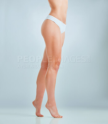 Buy stock photo Cropped shot of an unrecognizable woman posing in her panties