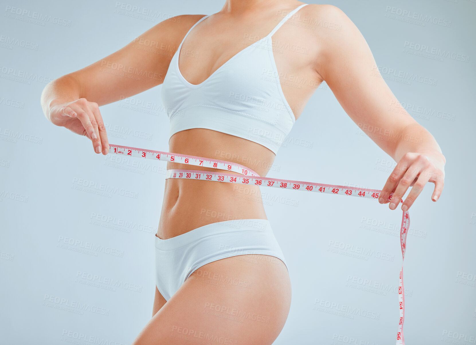 Buy stock photo Studio, tape and body of girl for wellness, health and progress for fitness in underwear. Woman model, tracking and measure waist with results for weight loss, personal goals and gray background