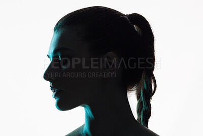 Buy stock photo Silhouette, studio and face of a woman on a white background with shadow and neon or creative glow in profile. Fantasy, light and shine of female model and side of person with art or dark aesthetic