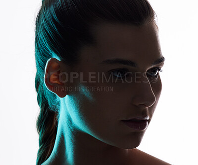 Buy stock photo Beauty, neon and silhouette with face of woman in studio for creative, glow and lighting mockup space. Fantasy, shadow and shine with female model on white background for art, disco or dark aesthetic