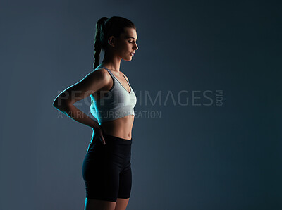 Buy stock photo Healthy, woman and model fitness in studio with activewear for workout goals, body progress and mockup space. Athlete, person and shadow with sportswear for training and exercise on gray background