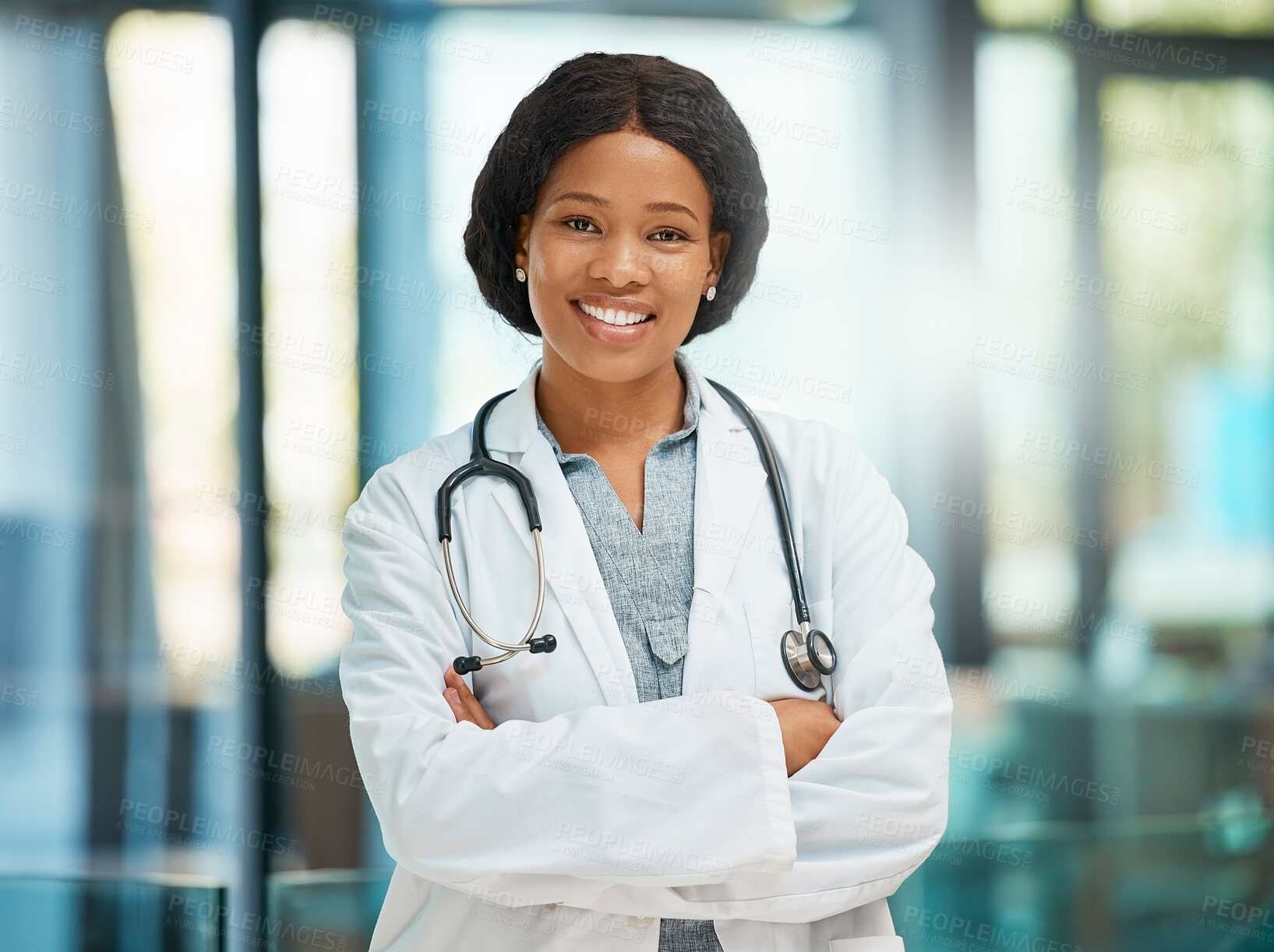 Buy stock photo Happy, portrait and surgeon with black woman, arms crossed and confidence of medical doctor job. Hospital, smile and healthcare professional with stethoscope and cardiology clinic employee at work