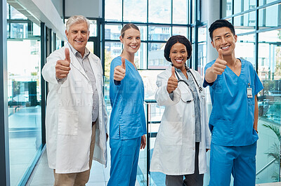 Buy stock photo Thumbs up, doctors and healthcare group in a hospital for support, teamwork and trust. Portrait of diversity men and women medical team hands for collaboration, professional care and health insurance