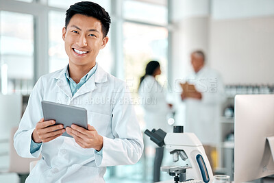 Buy stock photo Tablet, asian man and portrait of a scientist in laboratory, hospital or science research for medicine, chemistry or innovation. Doctor, technology and medical worker with smile in clinic or lab
