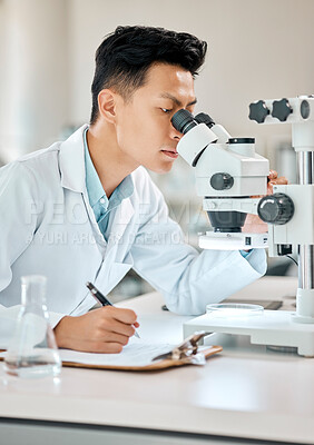 Buy stock photo Science, writing and microscope with an asian man doctor working in a lab for research or innovation. Healthcare, investigation and notebook with a male scientist in a laboratory for medical analysis