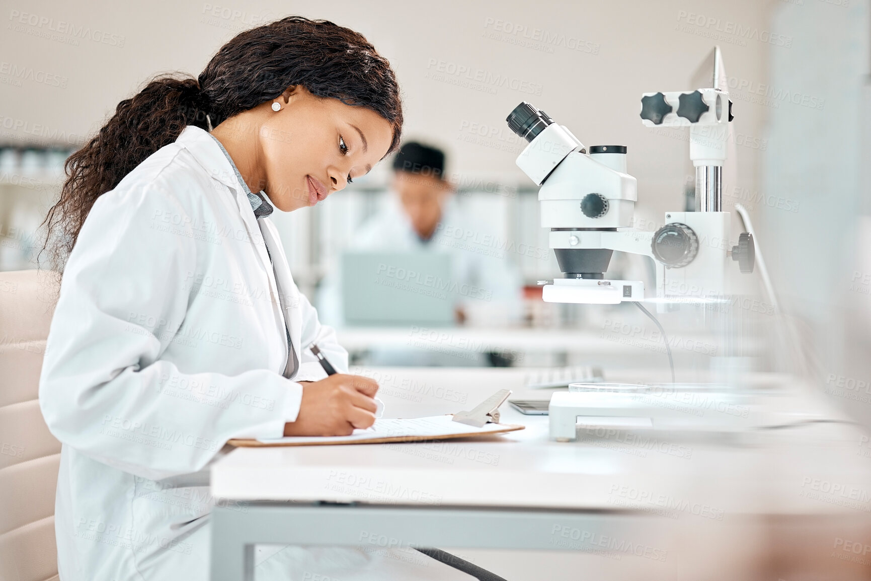 Buy stock photo Science, woman and writing with microscope in laboratory for observation, research and biology experiment for study. Girl, clipboard and clinical analysis for disease diagnosis and healthcare.