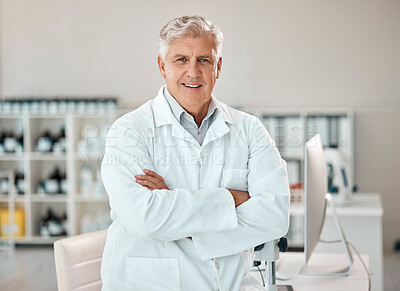 Buy stock photo Portrait of a senior scientist standing with his arms crossed in a lab