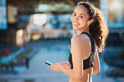 Buy stock photo Happy, woman and smartphone with earphones for fitness on break with exercise, running and workout in Atlanta. Outdoor, music and playlist, audio and podcast for health and wellness on portrait