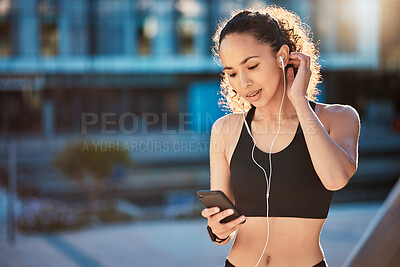 Buy stock photo Smile, woman and smartphone with earphones for fitness on break with exercise, running and workout in Atlanta. Female person, music and playlist, audio and podcast for health and wellness in outdoor