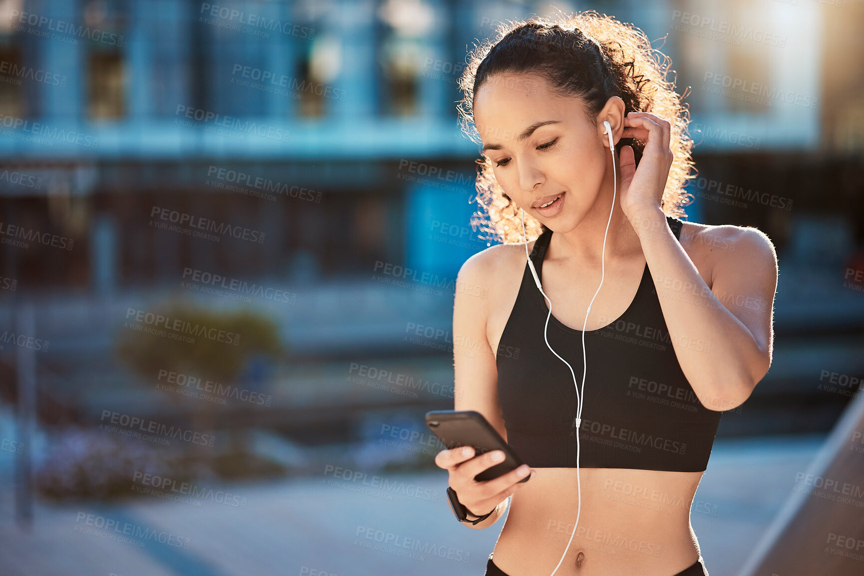 Buy stock photo Smile, woman and smartphone with earphones for fitness on break with exercise, running and workout in Atlanta. Female person, music and playlist, audio and podcast for health and wellness in outdoor