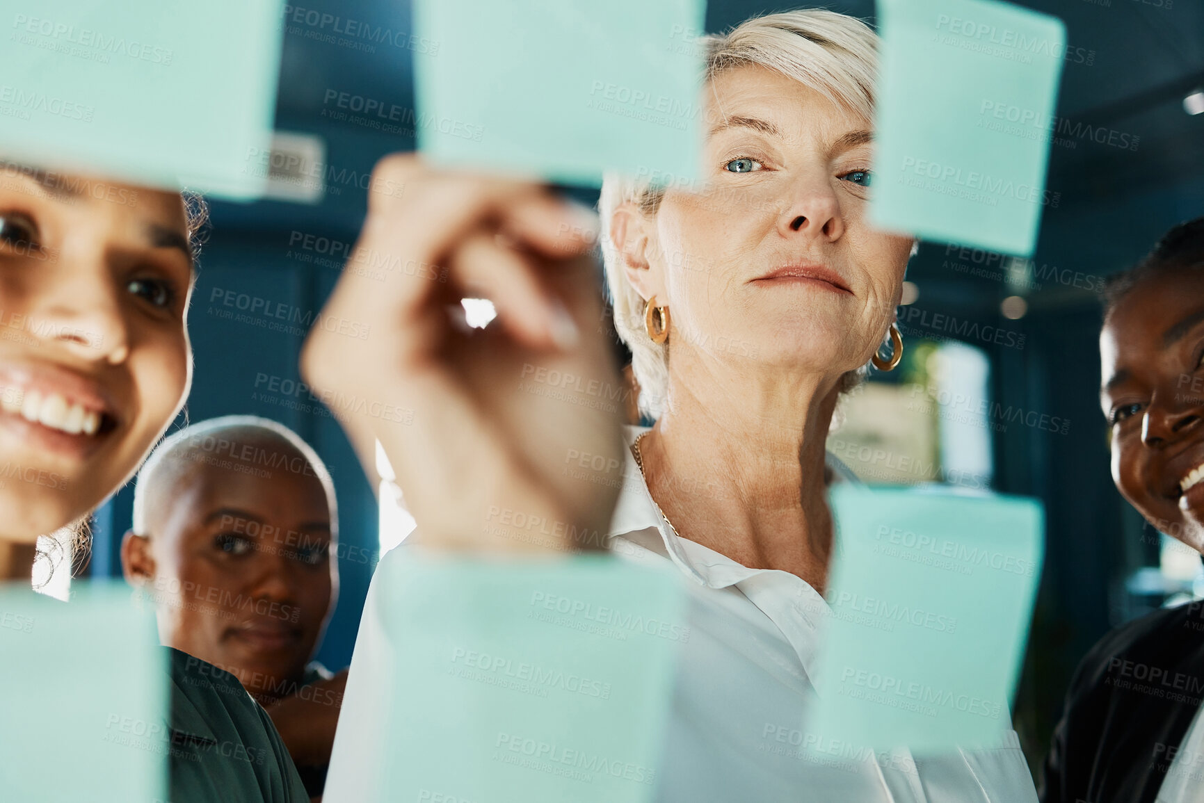 Buy stock photo Office, meeting and glass wall for discussion, planning and sticky notes with plan for report. Women, diversity and team for small business, teamwork and collaboration for partnership or b2b project