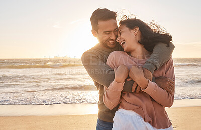Buy stock photo Young diverse biracial couple having fun at the beach together