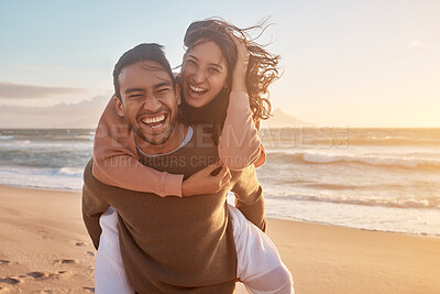 Buy stock photo Portrait of a young diverse biracial couple having fun at the beach together