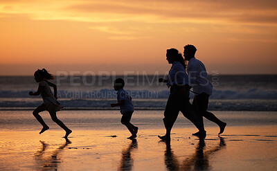 Buy stock photo Shot of an unrecognizable  family bonding while spending a day at the beach together