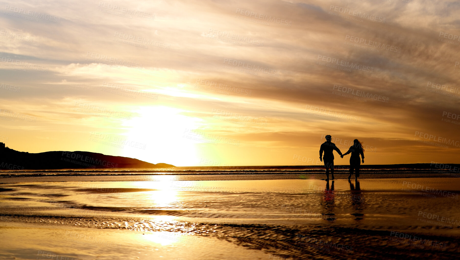 Buy stock photo Couple, sunset and walk by sea with space for mockup in summer sunshine with love, care and bond on holiday, Man, woman and holding hands with sky background, beach and clouds on romantic vacation
