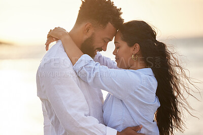 Buy stock photo Shot of a couple enjoying a day at the beach together