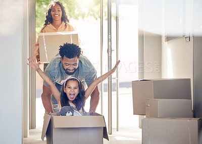 Buy stock photo Happy family, boxes and child playing in new home with smile, excitement and mortgage on property investment. Man, woman and girl in box in house, moving and investing in real estate, love and future
