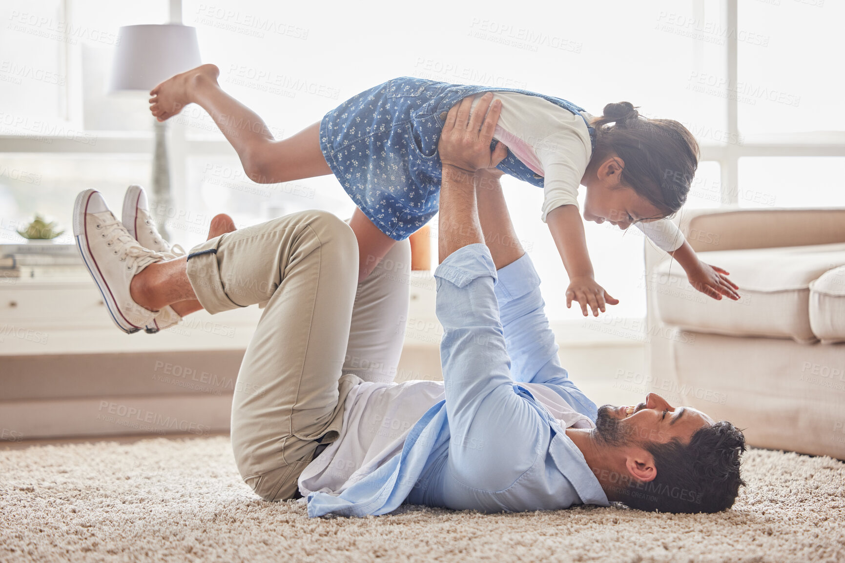 Buy stock photo Game, airplane and father with girl on a floor with love, fun and playing in their home together. Happy, flying and child with parent in living room for bonding, relax and enjoying weekend in lounge