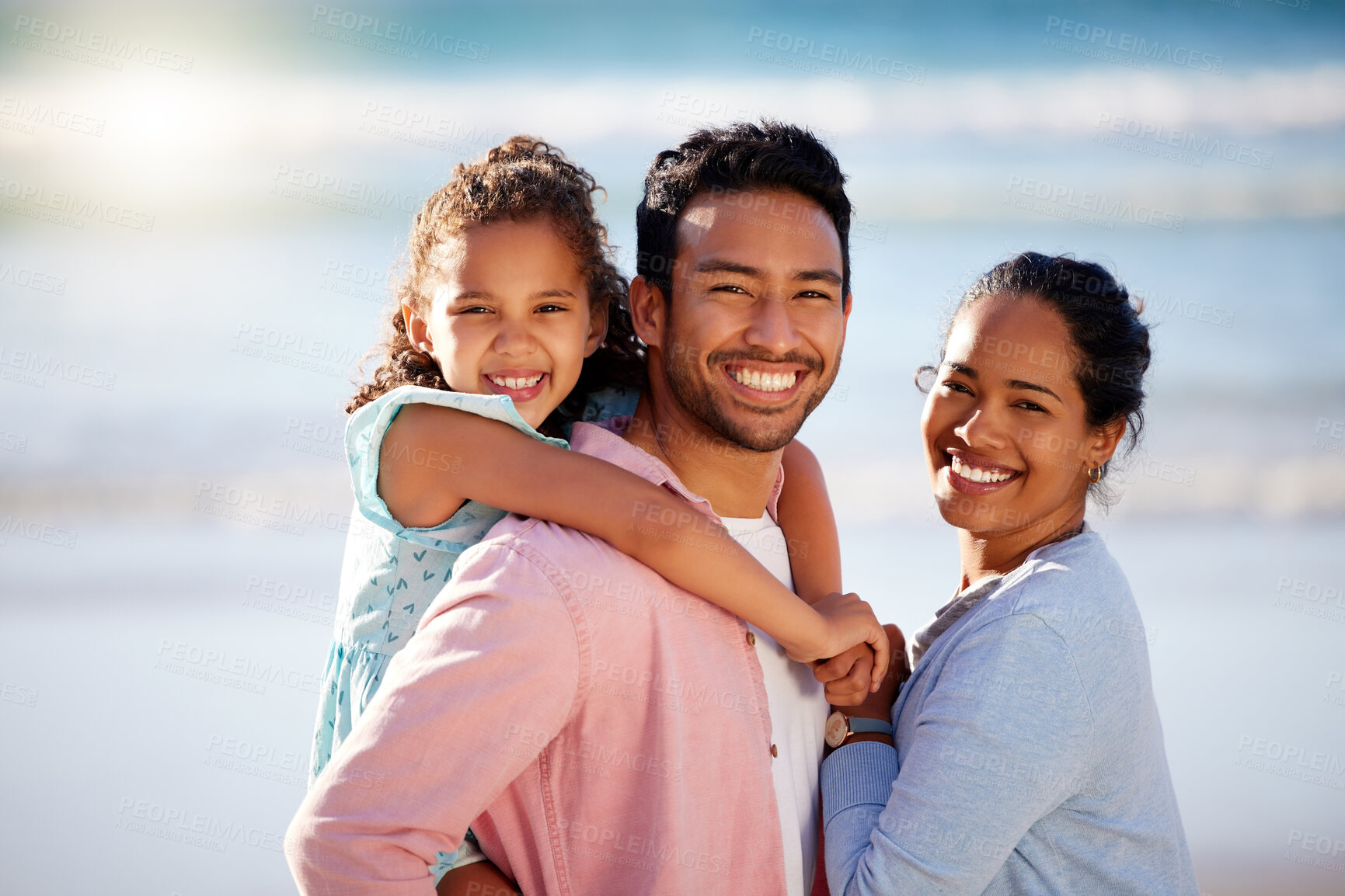 Buy stock photo Shot of a couple having fun outdoors with their adorable daughter