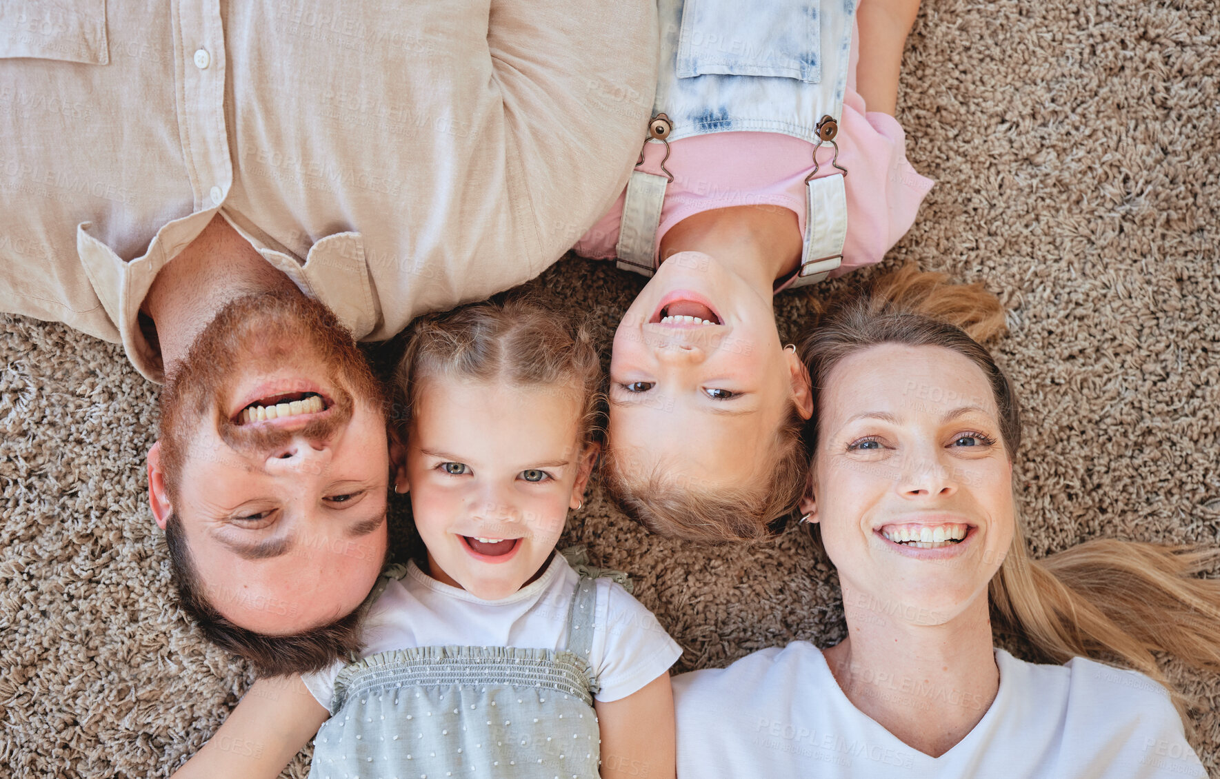 Buy stock photo Portrait, young kids and people with above for fun, education and bonding as family in living room. Cheerful children, dad and mother on floor for love, affection or care for growth and development
