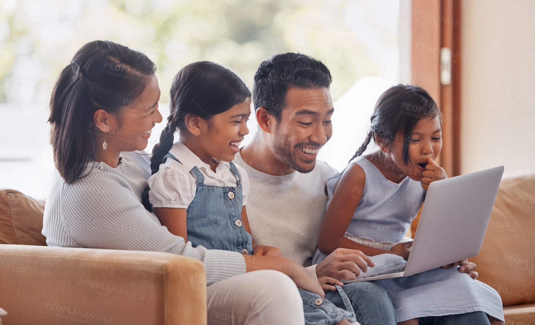 Buy stock photo Laptop, laughing and streaming with family on sofa in living room of home together for bonding or entertainment. Computer, movie or subscription service with mother, father and children in apartment