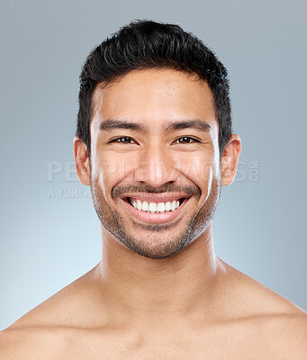 Buy stock photo Beauty, grooming and smile with portrait of man in studio on gray background for cosmetic wellness. Dermatology, natural and skincare with face of happy person in bathroom for hydration or hygiene