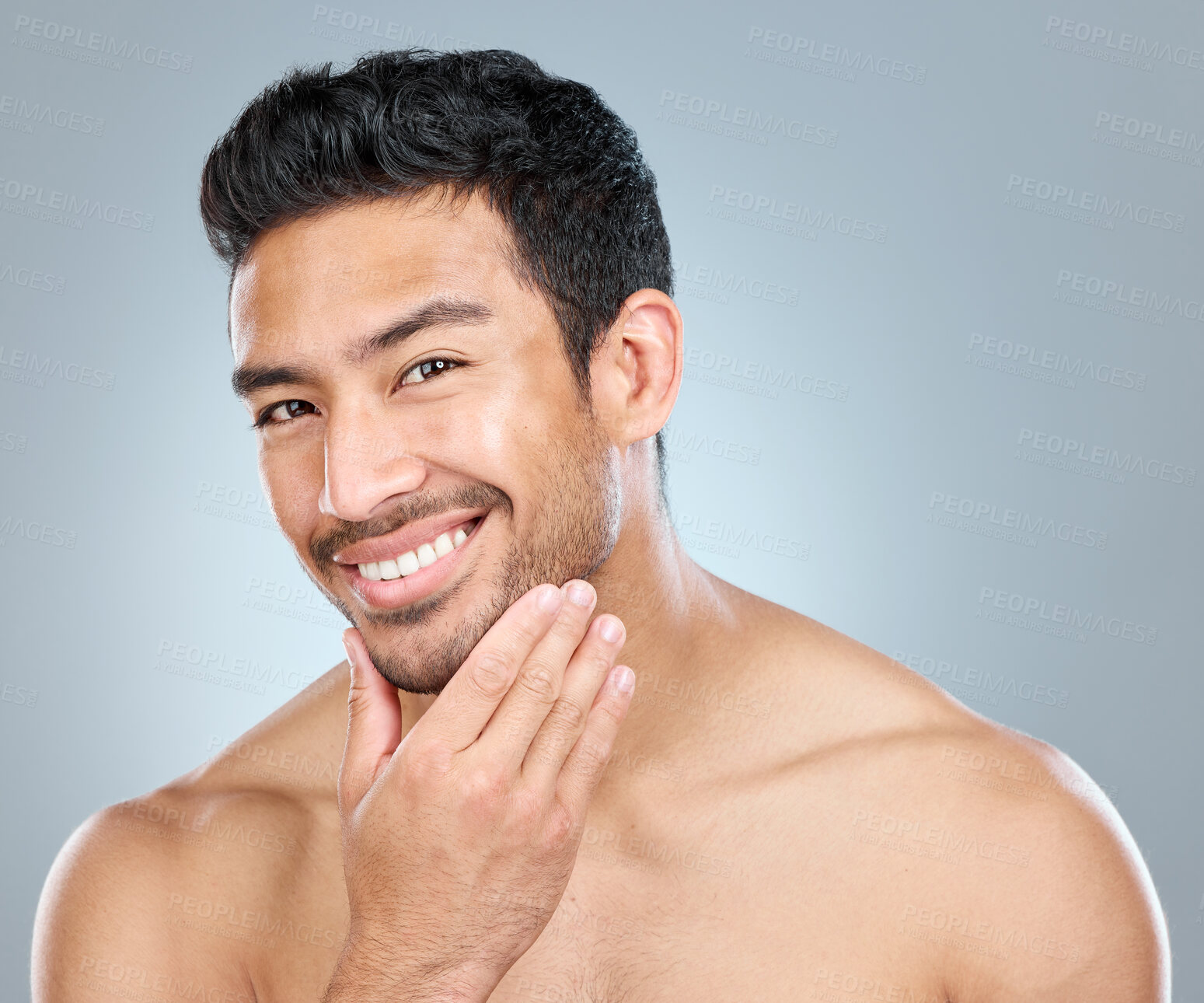 Buy stock photo Portrait, skincare and smile of masculine man in studio on gray background for cosmetic wellness. Beauty, dermatology and natural with face of confident person in bathroom for hydration or hygiene