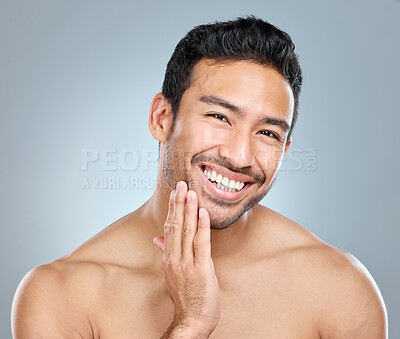 Buy stock photo Beauty, facial and grooming with portrait of man in studio on gray background for cosmetic wellness. Dermatology, natural and skincare with face of happy person in bathroom for hydration or hygiene