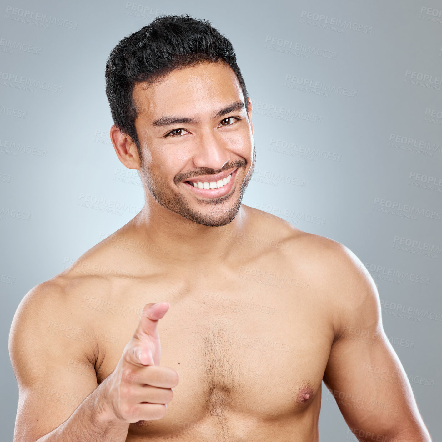 Buy stock photo Beauty, pointing at you and portrait of man in studio on gray background for cosmetic wellness. Choice, dermatology and skincare vote with of confident person in bathroom for hydration or hygiene