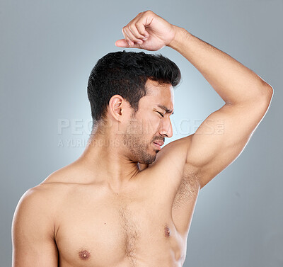 Buy stock photo Man, armpit and smell with disgust in studio for unpleasant odor, problem and stink of sweat. Topless, male person and underarm with bad hygiene for foul, scent and hyperhidrosis on gray background