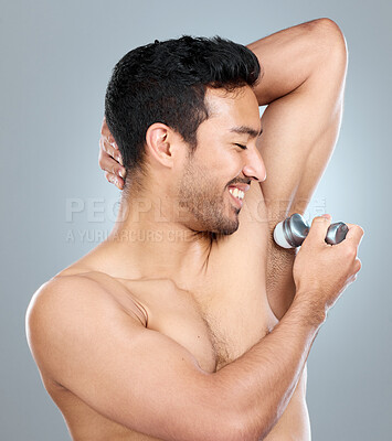 Buy stock photo Deodorant, health and man cleaning armpit against a gray studio background. Wellness, care and smile of topless model with underarm product for grooming, clean skin and routine for body hygiene